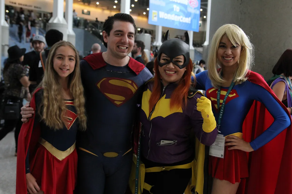 Superman, Supergirl and Batgirl costumes photographed at WonderCon in 2016